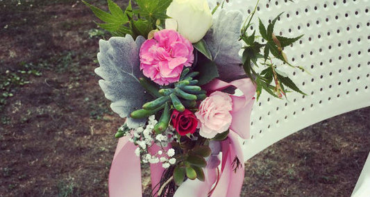 Spray carnations Spay roses Baby breath Sucullents Silver leave Ribbon